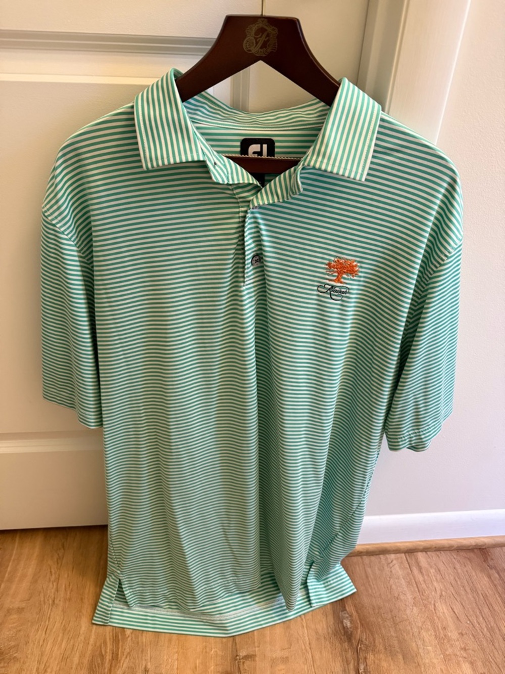 FootJoy Mint Green and White Striped Polo with Orange Tree Emblem